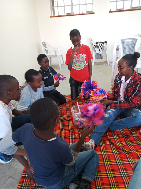 Children creating colourful crafts together in a CAN skills session
